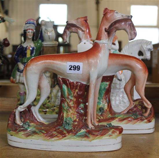 Pair Staffordshire greyhound with rabbit figures & two flatbacks, Highland couple & equestrian piper